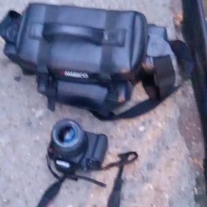 Canon professional camera works great comes with carrying case.  No sim card